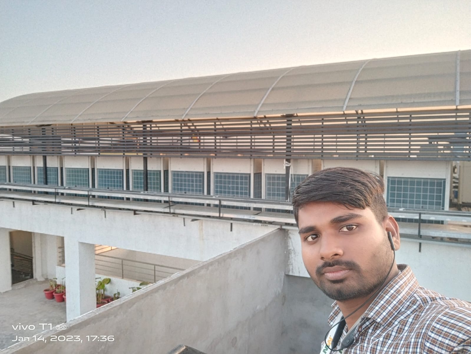 Onsite team member beside an outdoor system installation